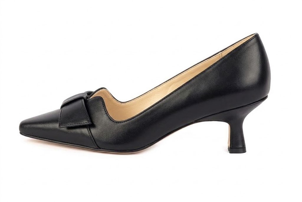 Women's black bow pumps with almond toe and mid spool heel - Profile view